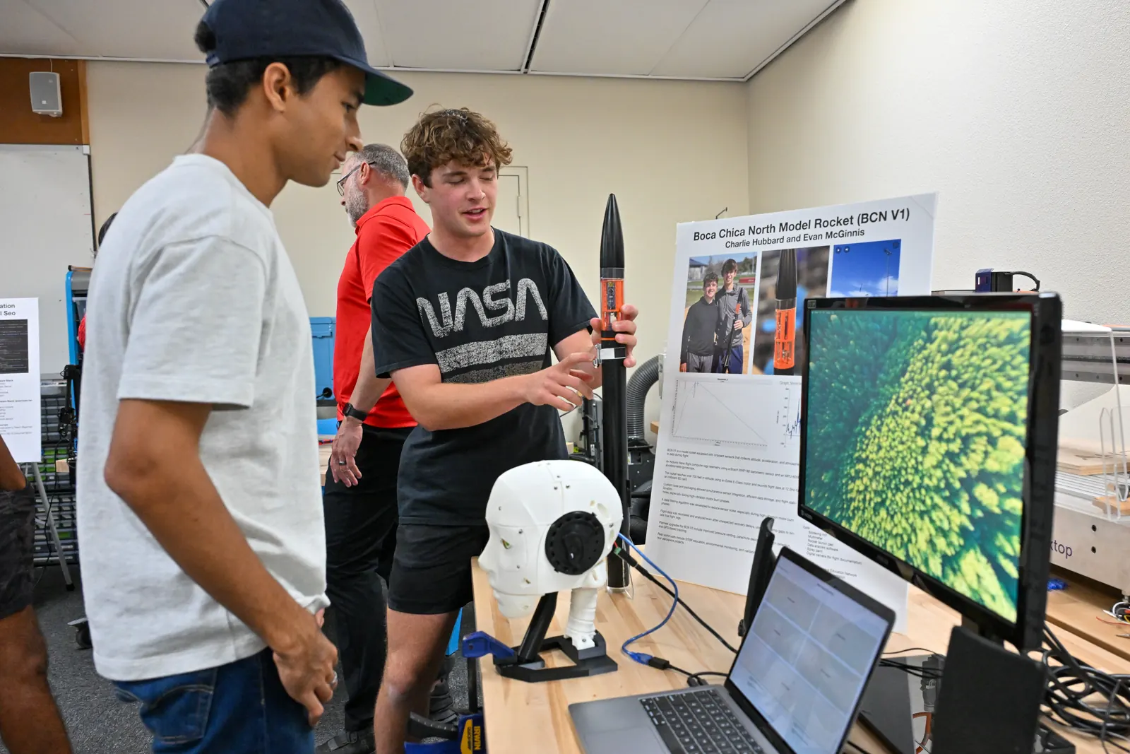 Charlie presenting the Boca Chica North model rocket project at a science showcase